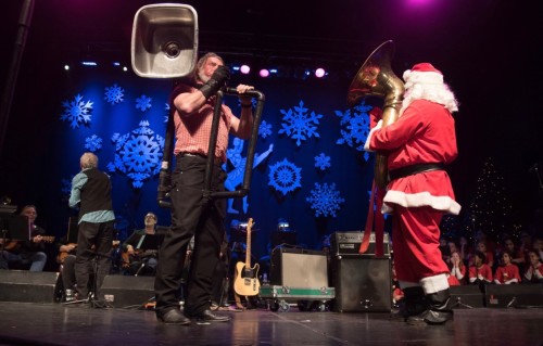 Santa playing the tuba with Washboard Hank on the kitchen sink.